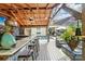 Inviting outdoor bar overlooking pool and backyard seating area, great for entertaining at 1701 Dearmon Dr, Charlotte, NC 28205
