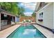 Backyard showcasing a beautiful pool, poolside bar, and relaxing lounge seating at 1701 Dearmon Dr, Charlotte, NC 28205