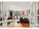 Salon room with hardwood floors, salon chairs, and ample natural light at 1701 Dearmon Dr, Charlotte, NC 28205