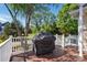 Spacious back deck with a grill and white railing overlooking the yard at 17130 Bridgeton Ln, Huntersville, NC 28078