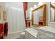 Beautiful bathroom with a vanity, large framed mirror, and luxurious bathtub at 17130 Bridgeton Ln, Huntersville, NC 28078