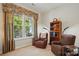 Cozy room with large window, reading chair, and bookcase at 17130 Bridgeton Ln, Huntersville, NC 28078