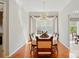 Elegant dining room with hardwood floors, large window, decorative lighting, and space for entertaining at 17130 Bridgeton Ln, Huntersville, NC 28078