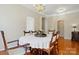 Formal dining room featuring beautiful hardwood floors and neutral paint, ideal for hosting dinner parties at 17130 Bridgeton Ln, Huntersville, NC 28078