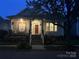 Charming home with inviting front porch, manicured landscaping, and ample natural light at 17130 Bridgeton Ln, Huntersville, NC 28078