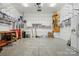 Well-equipped garage with extensive shelving, a utility sink, and ample space for storage and projects at 17130 Bridgeton Ln, Huntersville, NC 28078