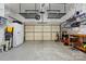 Spacious garage with ample storage racks, a workbench, and plenty of room for parking and projects at 17130 Bridgeton Ln, Huntersville, NC 28078