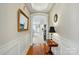 Inviting hallway with hardwood floors and architectural details at 17130 Bridgeton Ln, Huntersville, NC 28078