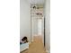 Hallway with neutral carpet, built-in shelves displaying toys, and view into another room at 17130 Bridgeton Ln, Huntersville, NC 28078