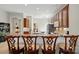 View of kitchen featuring counter seating, stainless steel appliances, tile backsplash, and ample counter space at 17130 Bridgeton Ln, Huntersville, NC 28078