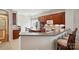 Spacious kitchen with dark cabinetry, breakfast bar seating, and modern appliances at 17130 Bridgeton Ln, Huntersville, NC 28078