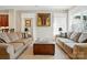 Comfortable living room featuring neutral decor, sofas, and decorative art, creating a warm and inviting space at 17130 Bridgeton Ln, Huntersville, NC 28078