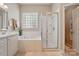Relaxing primary bath with tub, a separate shower, and a spacious vanity offering a serene retreat at 17130 Bridgeton Ln, Huntersville, NC 28078