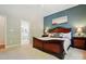 Comfortable primary bedroom suite includes a large window, soft carpeting, and en-suite bath at 17130 Bridgeton Ln, Huntersville, NC 28078