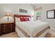 Comfortable bedroom with a large bed, stylish furniture, and natural light at 17130 Bridgeton Ln, Huntersville, NC 28078