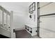 Convenient mudroom with storage bench, drop zone rack, and access to the garage for easy organization at 17130 Bridgeton Ln, Huntersville, NC 28078