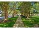 Beautiful tree lined street with sidewalk and well manicured lawns at 17130 Bridgeton Ln, Huntersville, NC 28078