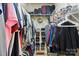 Spacious walk-in closet with ample shelving and storage for clothes, shoes, and accessories in neutral color palette at 17130 Bridgeton Ln, Huntersville, NC 28078