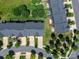 Aerial view of townhomes with dark roofs and manicured lawns at 1769 Evergreen Dr, Charlotte, NC 28208