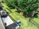 Aerial view of a fenced backyard with a concrete patio and a grill at 1769 Evergreen Dr, Charlotte, NC 28208