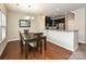 Cozy dining area with modern lighting, seamlessly connected to the kitchen for easy entertaining at 1769 Evergreen Dr, Charlotte, NC 28208