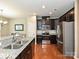 Well-equipped kitchen with granite countertops, stainless steel appliances, and hardwood flooring at 1769 Evergreen Dr, Charlotte, NC 28208
