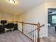 Upstairs landing with a built-in desk area and access to a bedroom with a view at 1769 Evergreen Dr, Charlotte, NC 28208