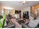 Comfortable living room with open layout to the kitchen and dining area, plus a staircase to the upper level at 1769 Evergreen Dr, Charlotte, NC 28208