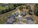 Aerial view of a home in a cul-de-sac, showcasing the landscaped yard, roof, and neighborhood layout at 19031 Brandon James Dr, Cornelius, NC 28031