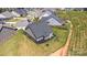Aerial view of the property displaying a well-maintained lawn, landscaping, and neighborhood at 19031 Brandon James Dr, Cornelius, NC 28031