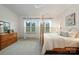 Bright bedroom features a four-poster bed, neutral walls, and plush carpeting at 19031 Brandon James Dr, Cornelius, NC 28031