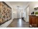 Inviting foyer with natural light, wood floors, and stylish decor to welcome you at 19031 Brandon James Dr, Cornelius, NC 28031