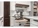 Modern kitchen features a pull-out mixer shelf and stainless steel appliances at 19031 Brandon James Dr, Cornelius, NC 28031