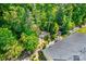Overhead view of the backyard, with mature trees providing shade and seclusion at 204 Aztec Cir, Mooresville, NC 28117