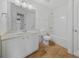 Well-lit bathroom featuring a single sink vanity and a shower-tub combo with a neutral color scheme at 204 Aztec Cir, Mooresville, NC 28117