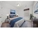 Cozy bedroom with a soft color palette and natural light from the window at 204 Aztec Cir, Mooresville, NC 28117