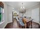 This dining area offers a view into the kitchen and the staircase at 204 Aztec Cir, Mooresville, NC 28117