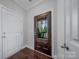 A welcoming foyer featuring a decorative glass door and hardwood flooring, setting an elegant tone for the home at 204 Aztec Cir, Mooresville, NC 28117