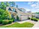 Charming home with a two-car garage, well-manicured lawn, and delightful curb appeal, perfect for suburban living at 204 Aztec Cir, Mooresville, NC 28117