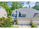 Charming two-story home with a well-manicured lawn, two-car garage and lush landscaping at 204 Aztec Cir, Mooresville, NC 28117