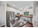 Bright kitchen with stainless steel appliances and granite countertops at 204 Aztec Cir, Mooresville, NC 28117