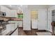 Convenient kitchen with laundry closet featuring a washer and dryer at 204 Aztec Cir, Mooresville, NC 28117