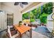 Cozy covered patio featuring comfortable seating and a dining table, perfect for outdoor entertaining at 204 Aztec Cir, Mooresville, NC 28117