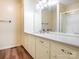Bright bathroom featuring a large mirror, updated vanity, and a shower with glass door at 2222 Hearthstone Dr, Gastonia, NC 28056