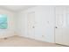 This bedroom offers a neutral palette, two closets, and a window for natural light at 2222 Hearthstone Dr, Gastonia, NC 28056