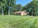 Charming single story home with brick exterior and lush, green front lawn at 2222 Hearthstone Dr, Gastonia, NC 28056