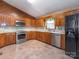Well-equipped kitchen with stainless steel appliances and ample cabinet space at 2222 Hearthstone Dr, Gastonia, NC 28056