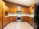 Beautiful kitchen featuring stainless steel appliances and wood cabinets at 2222 Hearthstone Dr, Gastonia, NC 28056