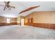 Vast, open-plan living area showing wood trim and neutral carpet, featuring a ceiling fan at 2222 Hearthstone Dr, Gastonia, NC 28056