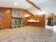 Spacious living room with stone fireplace and view into the kitchen at 2222 Hearthstone Dr, Gastonia, NC 28056